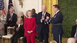 Biden gives Hillary Clinton award, appears to kiss her at end