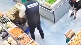 Elderly woman and supermarket worker have a standoff