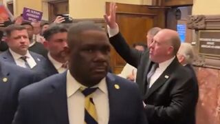 Tom Homan waves to protesters invading the NY State Capitol