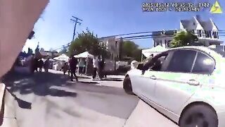 Woman drives through a festival to get to work