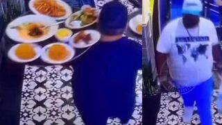 Guy purposely knocked down SIX plates waiter was carrying