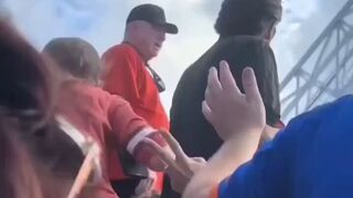 Guy picks up girlfriend by the pants to stop a fight