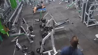 Man fakes tripping and slams dumbbell on a guy’s head