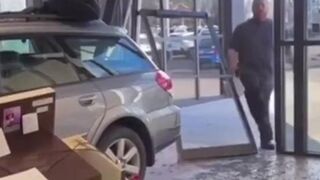 Man crashes car through dealership during meltdown