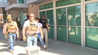 Masked federal agents were outside courthouse in unmarked vans waiting for migrants