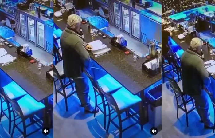 Dude takes a leak at the bar, caught on camera