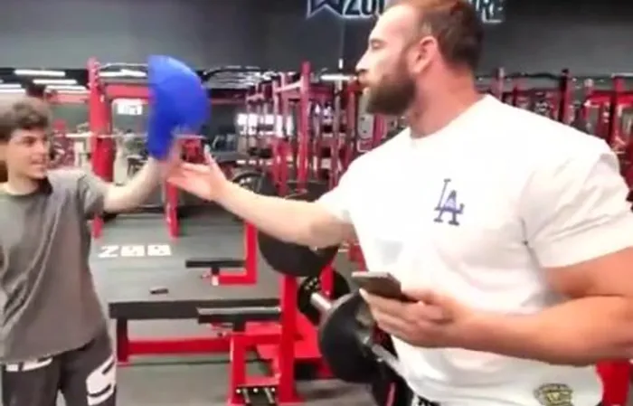 Streamer steals a bodybuilders hat at the gym, gets SLAPPED in the face