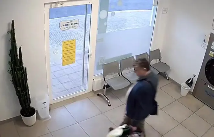 Guy walks out of laundromat right before it EXPLODES