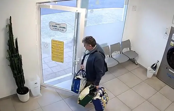 Guy walks out of laundromat right before it EXPLODES