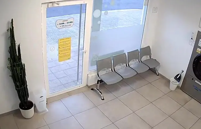 Guy walks out of laundromat right before it EXPLODES