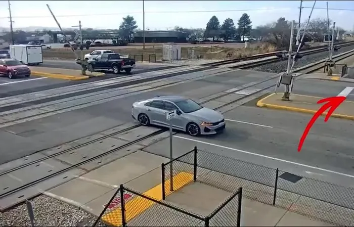 Driver JUMPS out of car, leaving it to get SMASHED by train