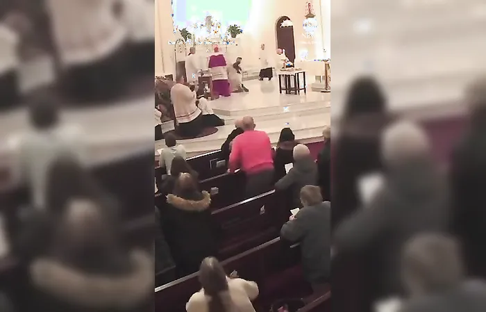 Guy bulrushes altar during prayer service, attacks priest