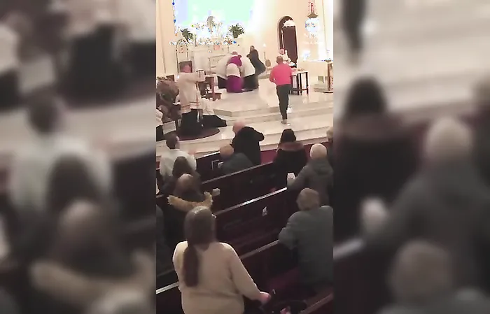 Guy bulrushes altar during prayer service, attacks priest