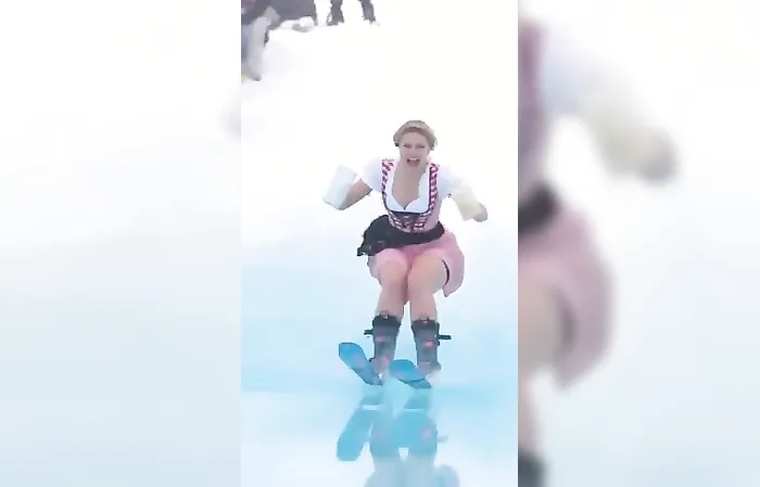 Woman goes skiing with two giant beer mugs