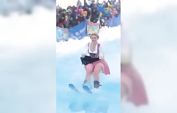 Woman goes skiing with two giant beer mugs