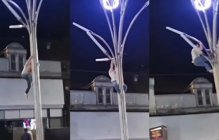 Man climbs weird light post to save a seagull