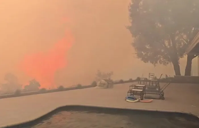 'Our deck three minutes ago" - James Woods shares wildfire video
