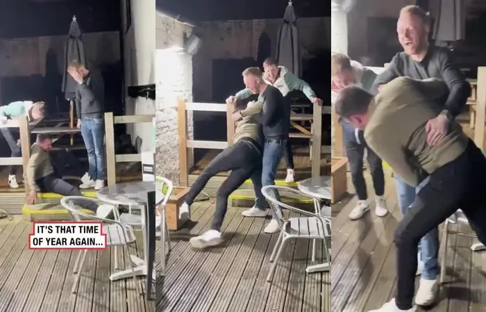 drunk guys keep slipping on ice, can't stop laughing