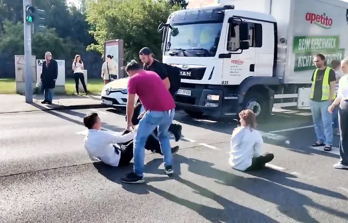 Fed up people throw protesters out of the street, drag by the hair