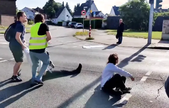 Fed up people throw protesters out of the street, drag by the hair