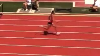 Runner falls, then rolls across finish line to victory in 100m hurdles