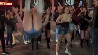 College girl does backflip in the streets, top falls down
