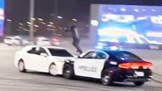 Cop pulls off epic Matrix/John Wick style move from a moving car
