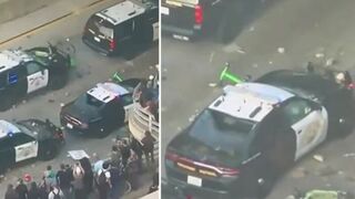 LA rioters launched electric scooters off the overpass at cop cars