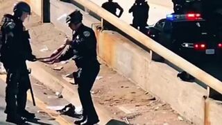 Cops stopped to fold an abandoned American flag during LA riots