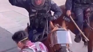 Horse cops beat protesters with sticks