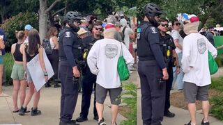Police tell protesters to remove face coverings or leave