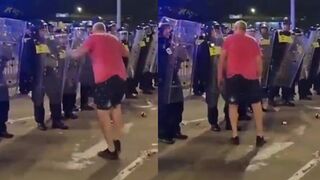 Cop gives protester a face full of riot shield