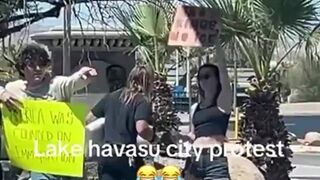 Guy holds up funny sign mocking protesters