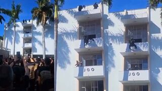 Cop is like spiderman taking out suspect holding someone hostage