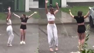 Girls getting wet and dancing in the rain