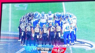 Detroit Lions and Atlanta Falcons players pray after Maurice Norris neck injury