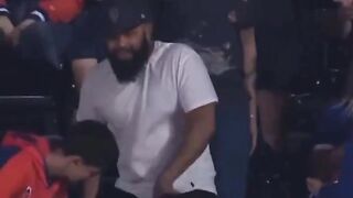 Guy rips the baseball from an older man at Mets game