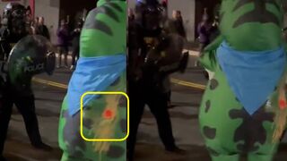 Officers sprays mace in the air vent of a costume wearing Antifa member in Portland