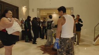 Boxer Ryan Garcia punches Gorlock in the stomach repeatedly