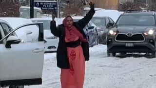 Woman blocking traffic so she can scream into the clouds