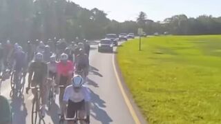 Cyclists hog the road, so driver has other ideas