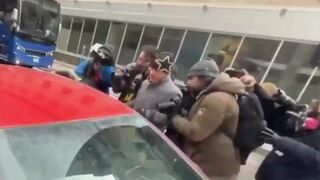 Protesters storm random car for no reason, this is getting tiring