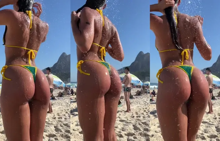 Water glistens on the beach thong