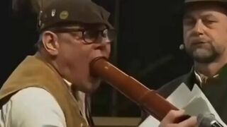 This looks like Tim Walz sucking on wood