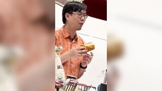 Eating a pizza wrapped Costco hotdog