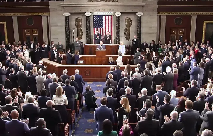 The "NO KINGS" crowd greets King Charles with a standing ovation