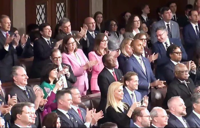 The "NO KINGS" crowd greets King Charles with a standing ovation