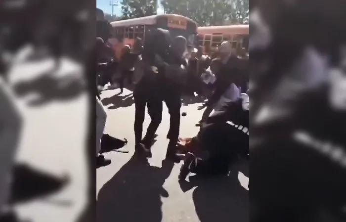 Cop body-slammed a female student during brawl, now HE's the one in trouble