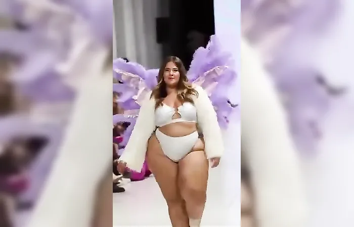 Plus size woman struts on the runway