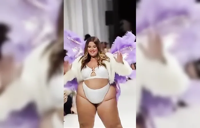 Plus size woman struts on the runway